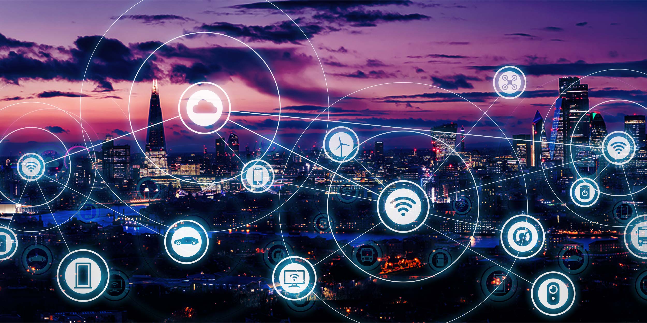 London skyline at twilight superimposed with icons representing Internet of Things (IoT) devices connected with V12's Multi-Network Data SIM